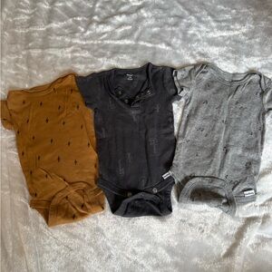 Gerber 3-Pack Baby Onesies in Mustard, Charcoal, and Heather Gray